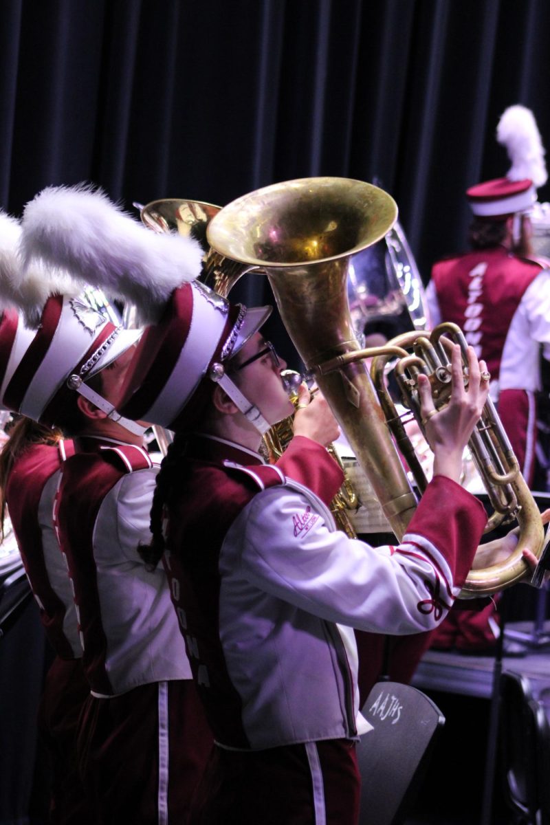 Ready and focused. During the halftime portion of the Bandarama concert, the musicians flare on their final note. 
