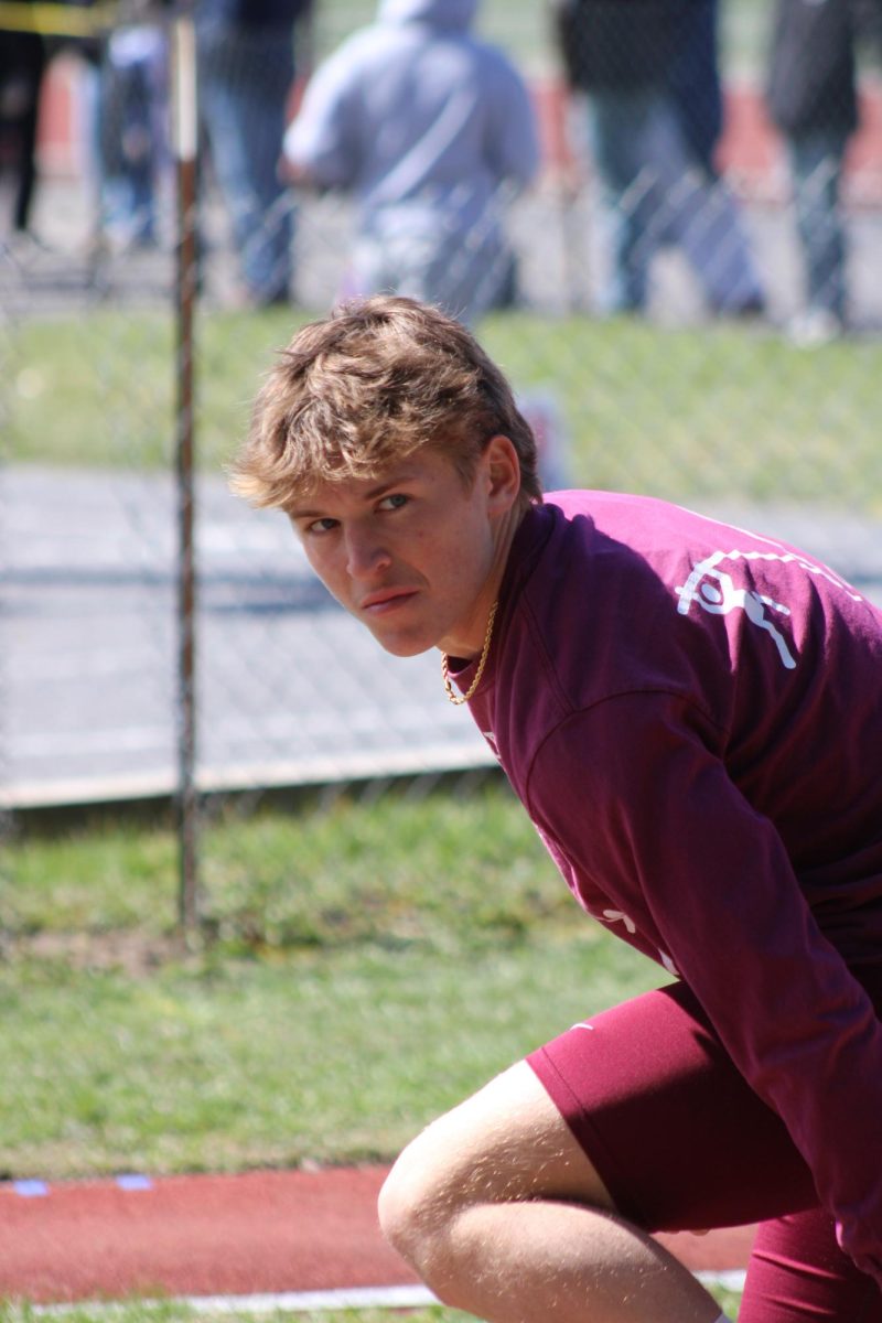 Eye contact. Senior Colin Lutz stares in to the stands. He placed third in the meet overall for pole vault