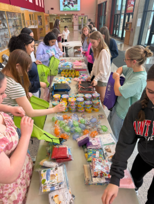 Packing up. Girls' League put together baskets for sick children in the hospital over Easter (courtesy of Megan Yingling). 