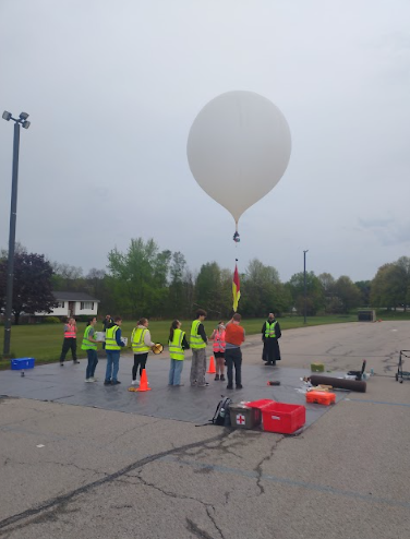 Launch day. The student team launches a weather balloon into the upper atmosphere. The balloon rose up 72,000 feet. (Courtesy of Delaney Beecher) 